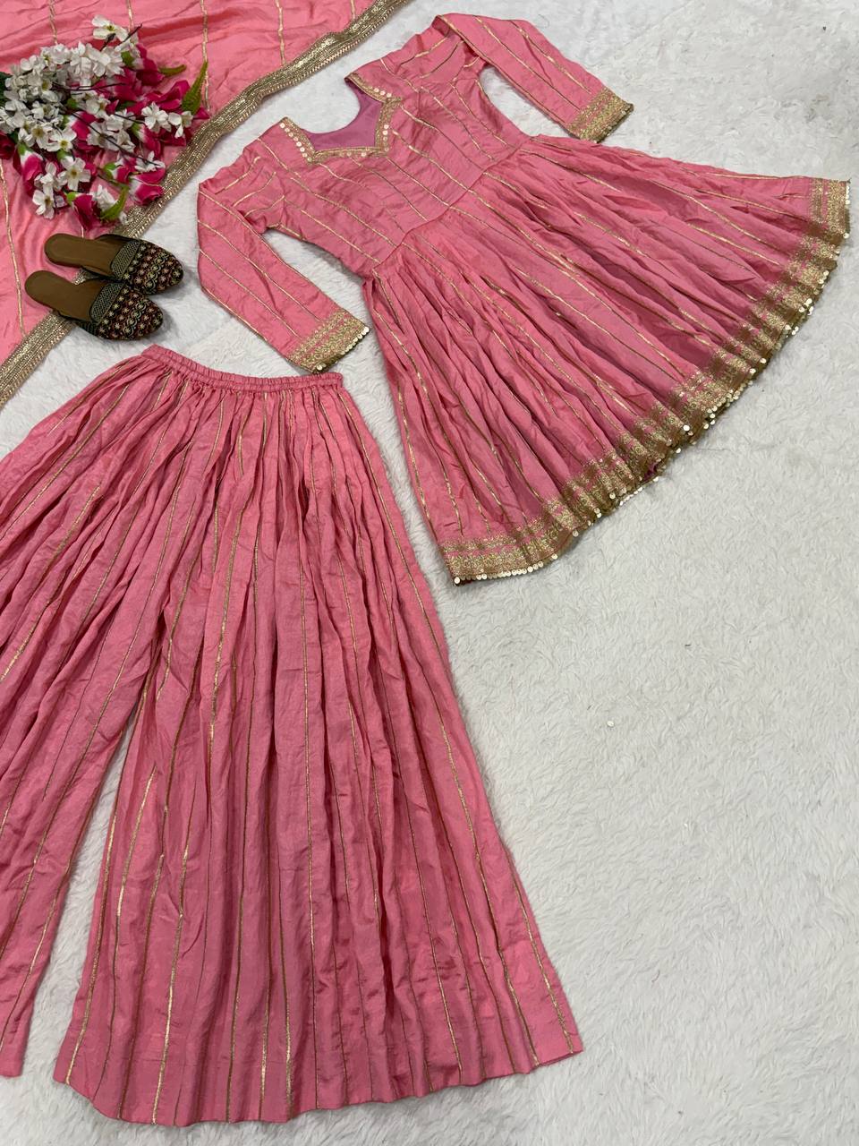 Radiant Rose Pink Flared Peplum Kurti and Sharara Set Embellished with Luminous Gold Zari Stripes and Sequined Borders